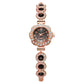Elegant damklocka med strass och blommig bezel